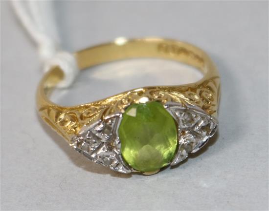 An 18ct gold, peridot and diamond cluster ring, size N.
